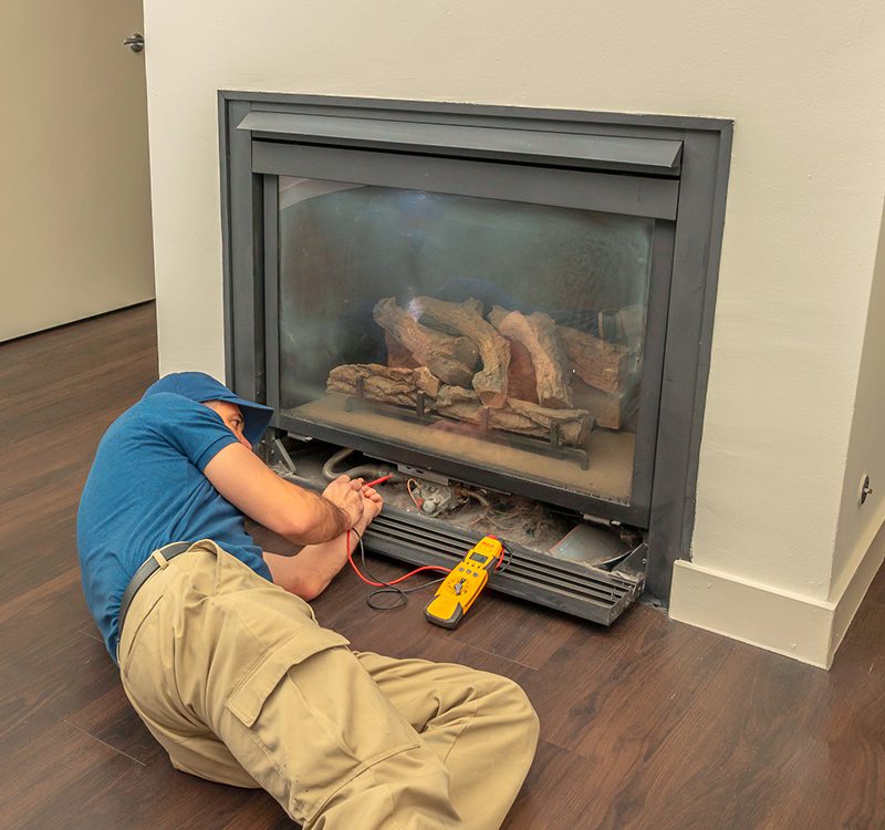 technician doing fireplace maintenance and repair in Tillsonburg